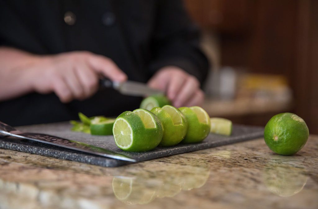 Personal chef cutting limes