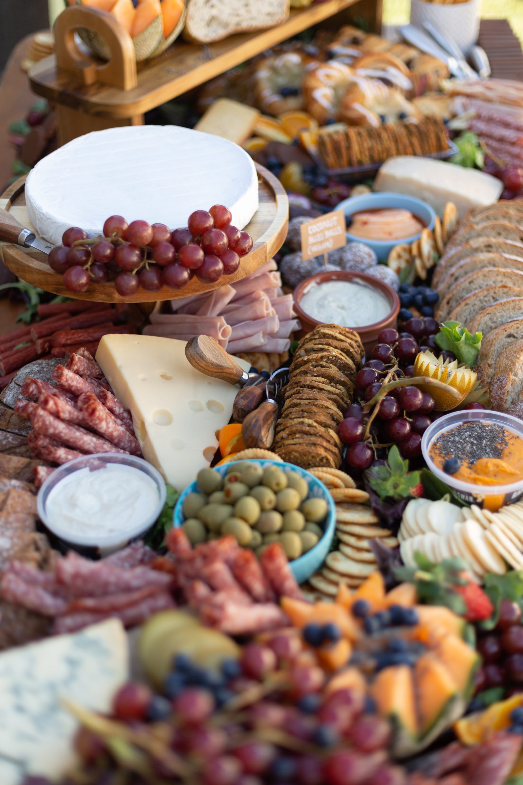 boutique catering spread on a fancy outdoor picnic table